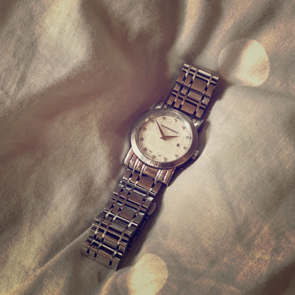 Used but great authentic Burberry silver with mother of pearl watch w/ diamonds